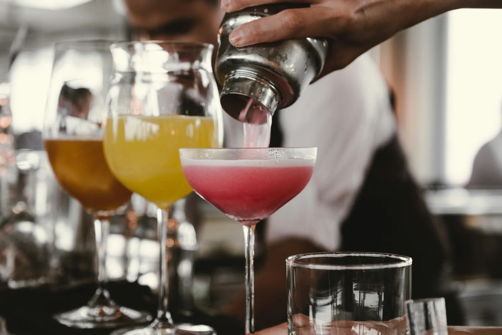man pouring cocktails: Cocktail Photography