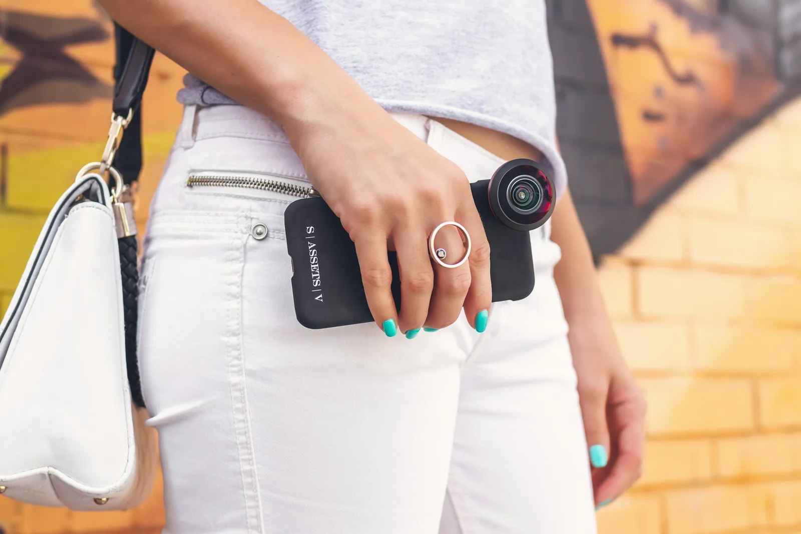 person with camera: How to Take Pictures of Jewelry With a Phone