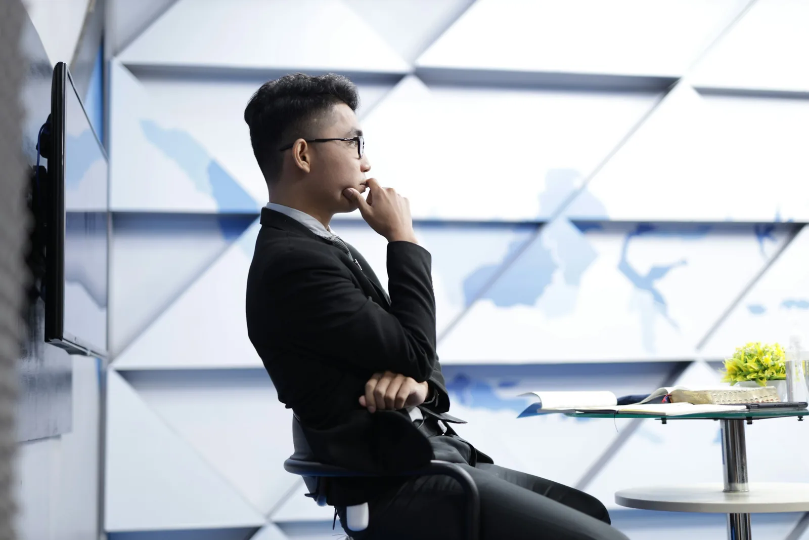 man thinking sitting on a chair: Product Photography Pricing