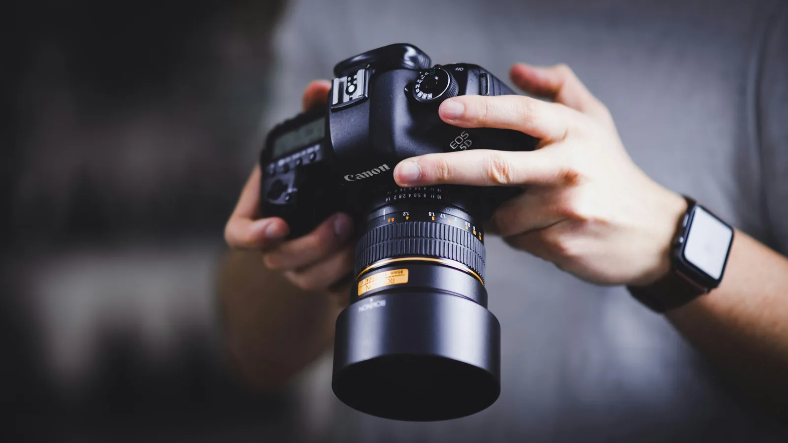 man holding camera: eCommerce Photography