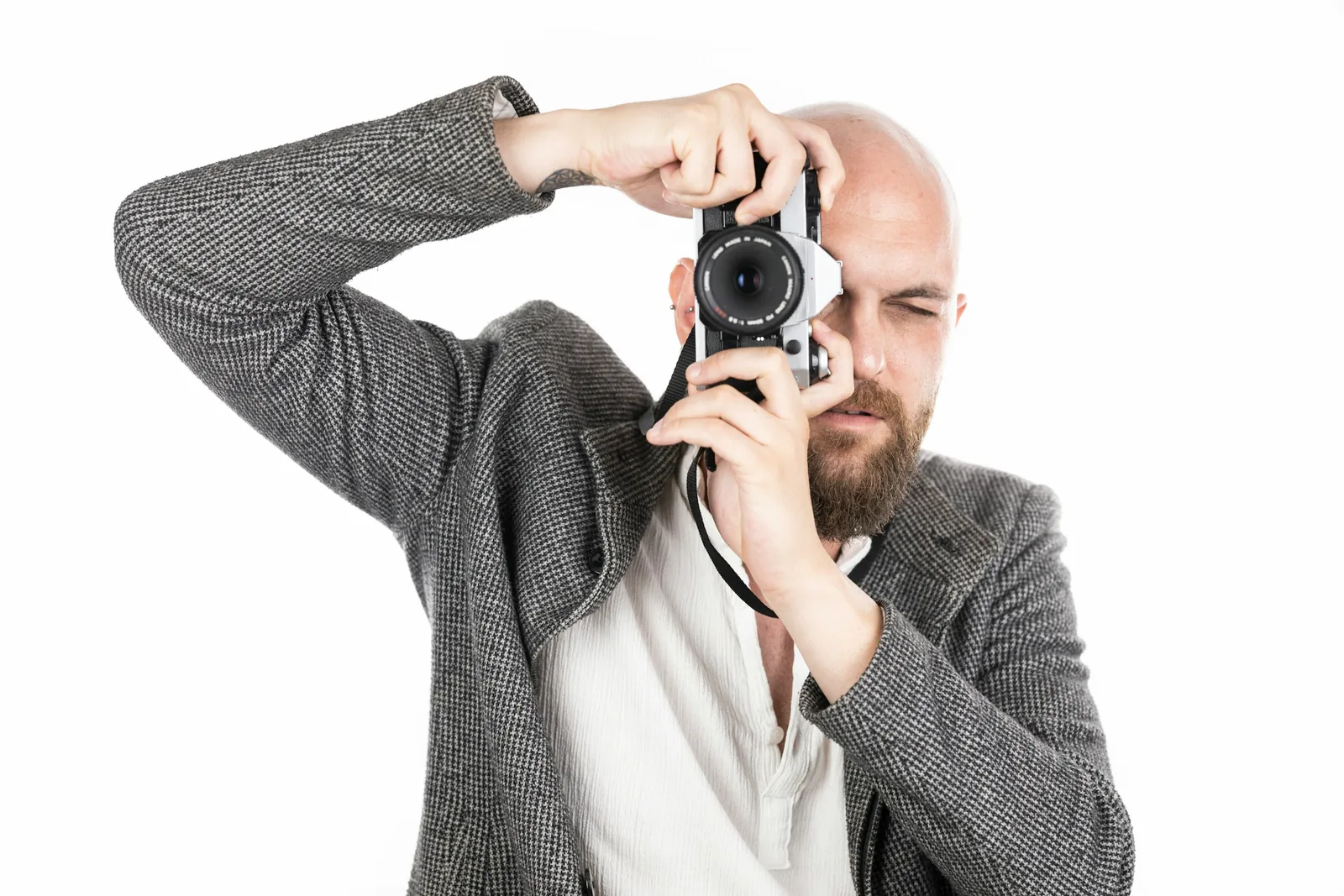man with camera: How to Take the Best Product Photos