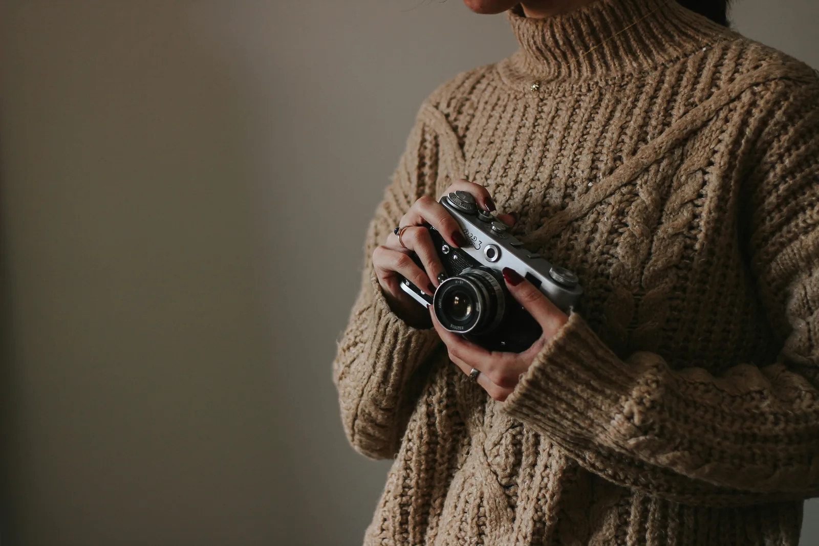 woman with camera: How To Take Pictures Of Clothes To Sell Online