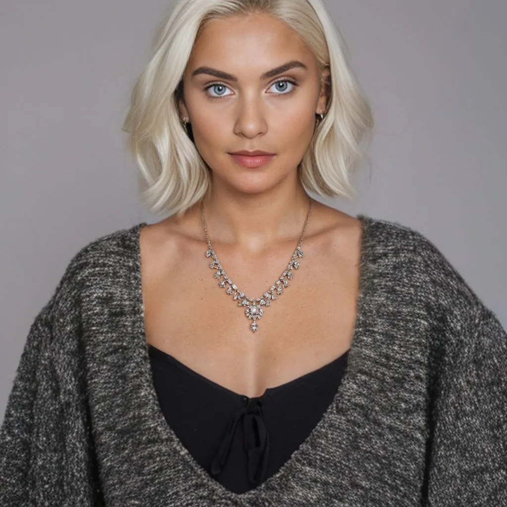 25 year old caucasian model wearing detailed necklace, mid-range shot includes shoulders. This time with blonde hair