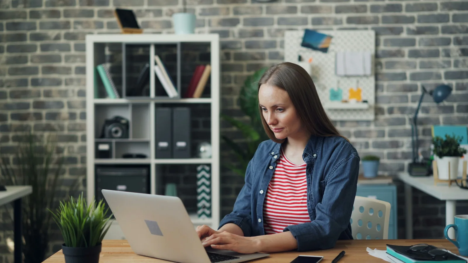woman working: Invideo AI Competitors