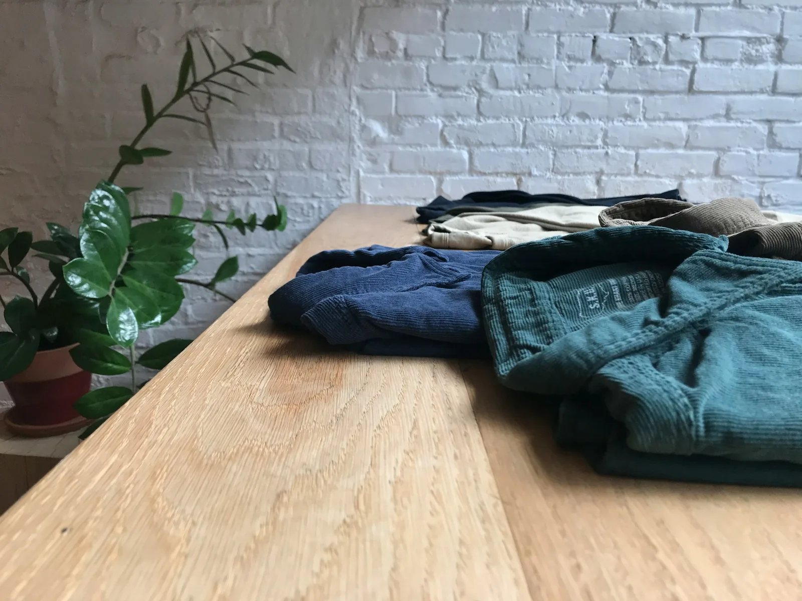 jackets on table: How To Take Pictures Of Clothes To Sell Online