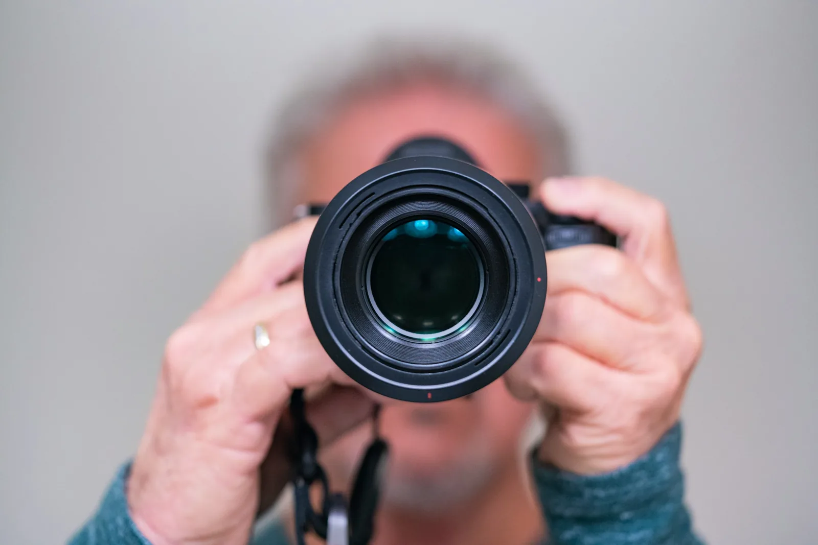 person with camera: Best Lens for Food Photography