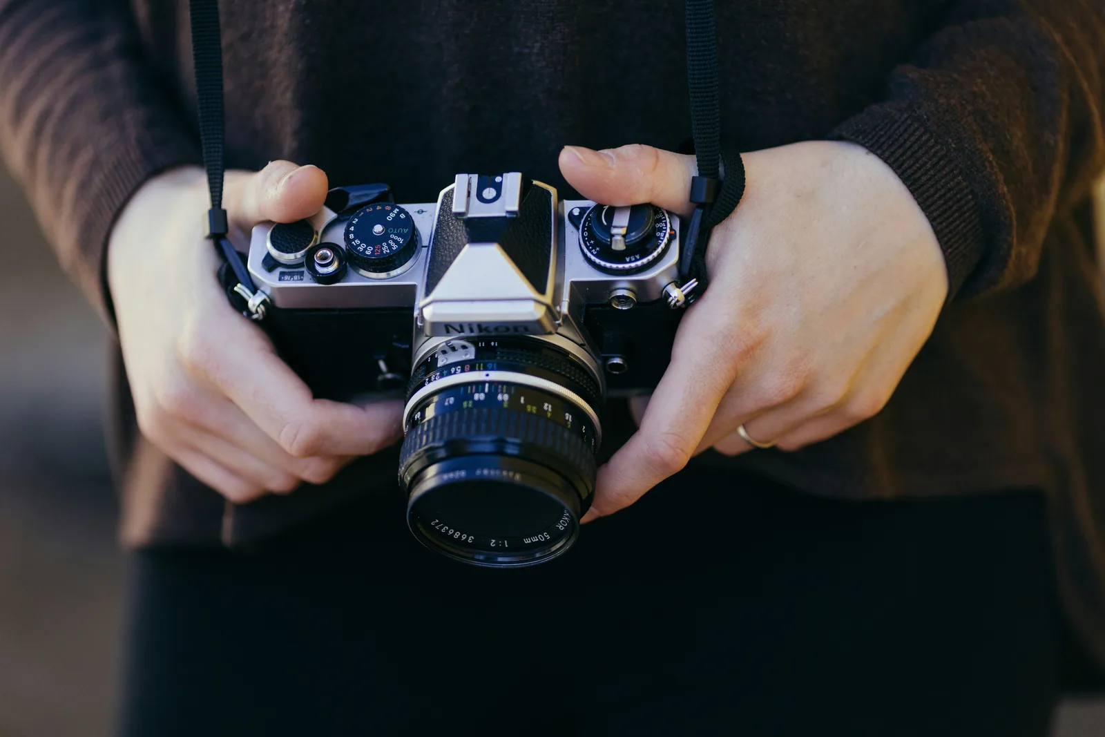 person holding camera: How To Shoot Product Photography