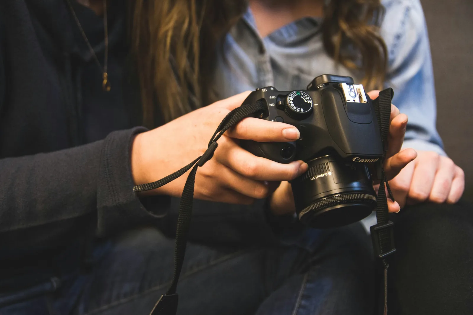 person checking results: Best Camera For Product Photography