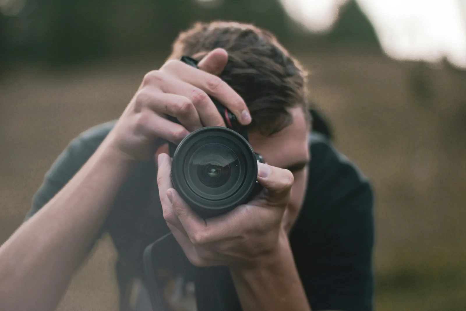 person taking picture: How To Shoot Product Photography