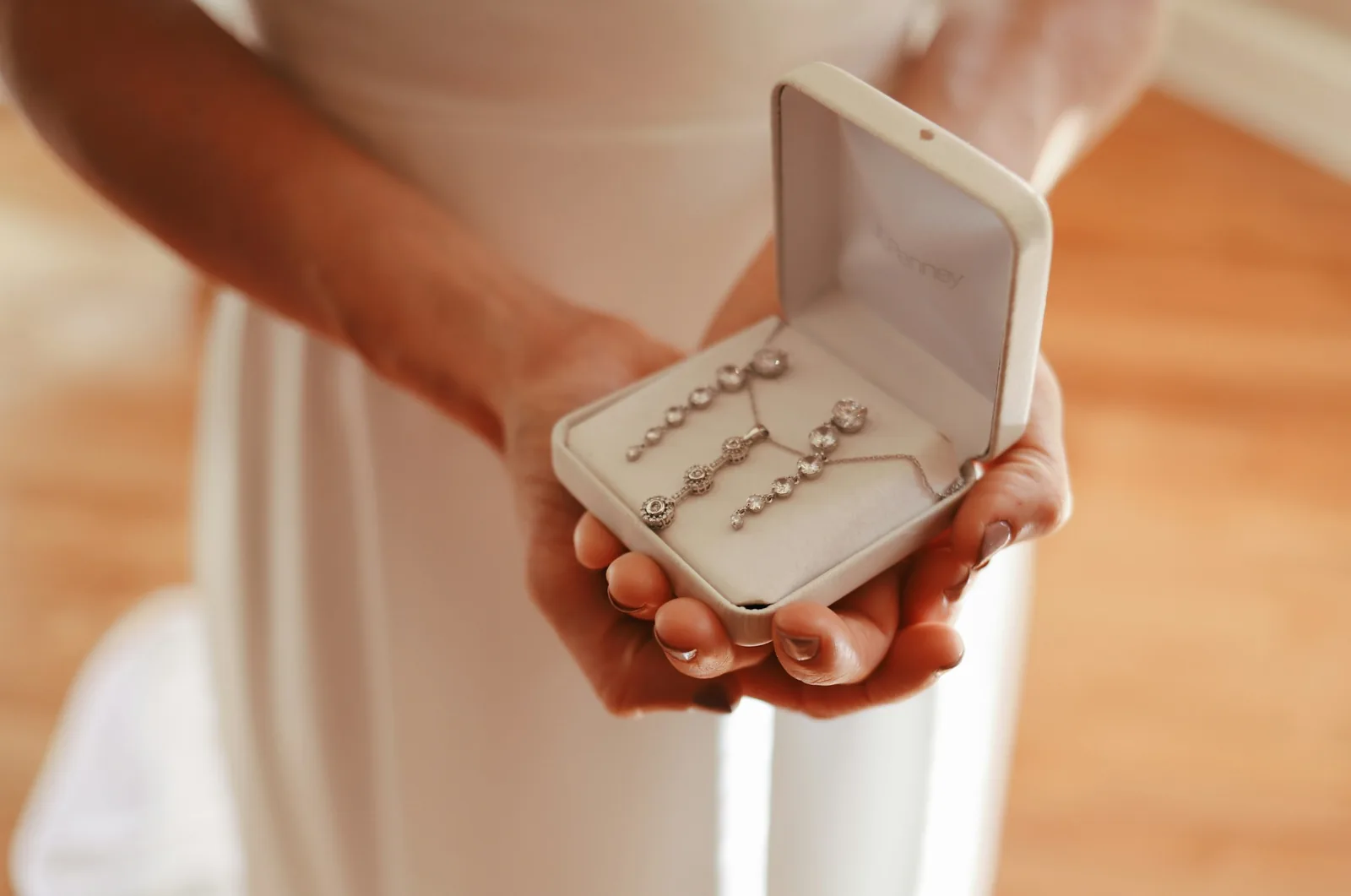 person showing jewelry box: Light Box Photography for Jewelry